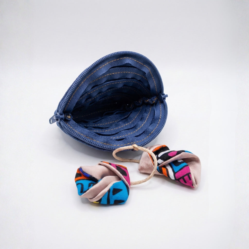 Blue triangular coin purse with African print pendant.