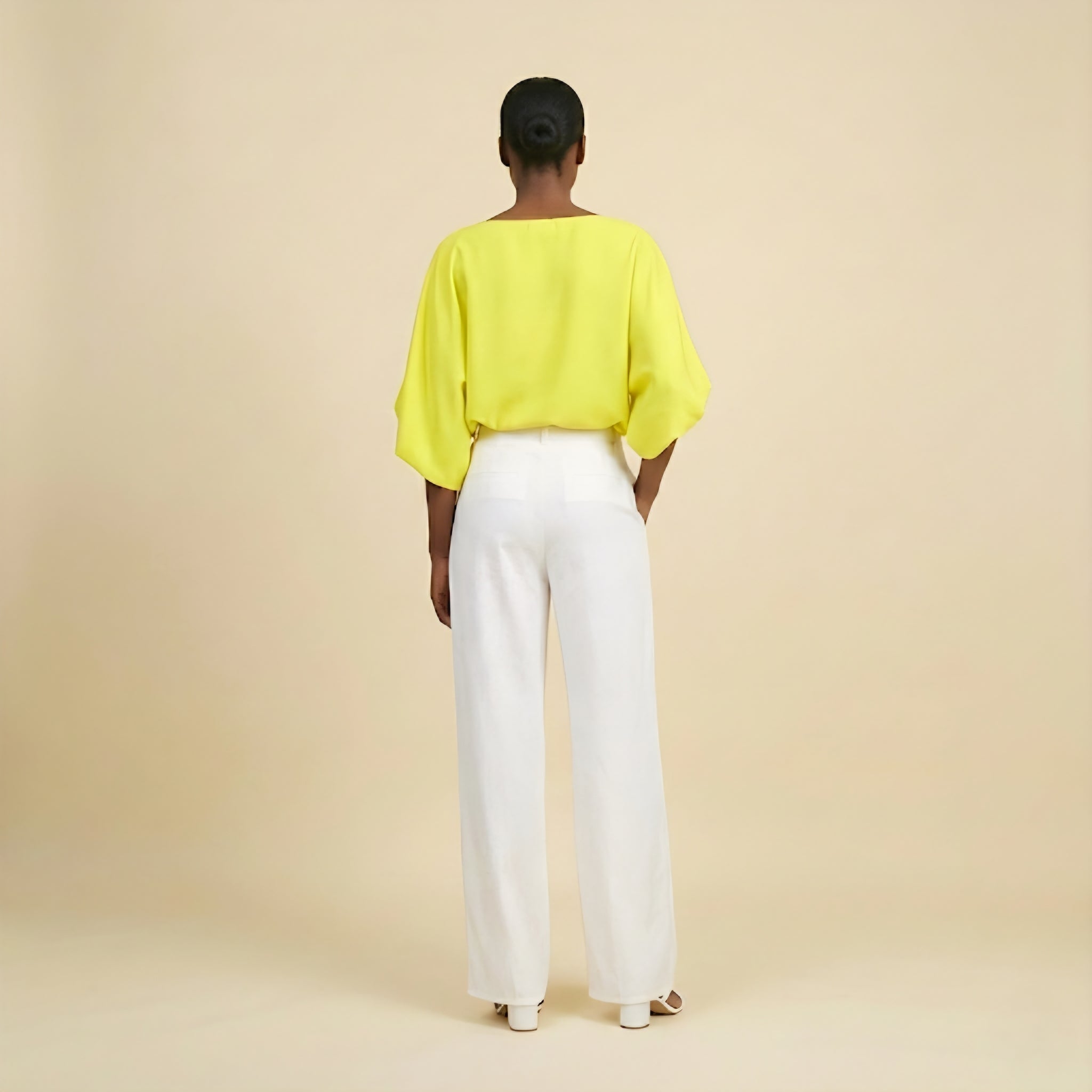 White wide-leg pants and flowy sun-kissed top set.