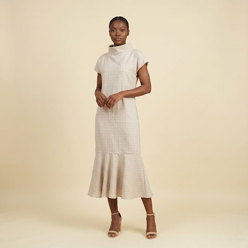 High-neck dress with tie closure.