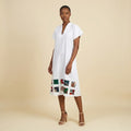 White twill dress with printed back.